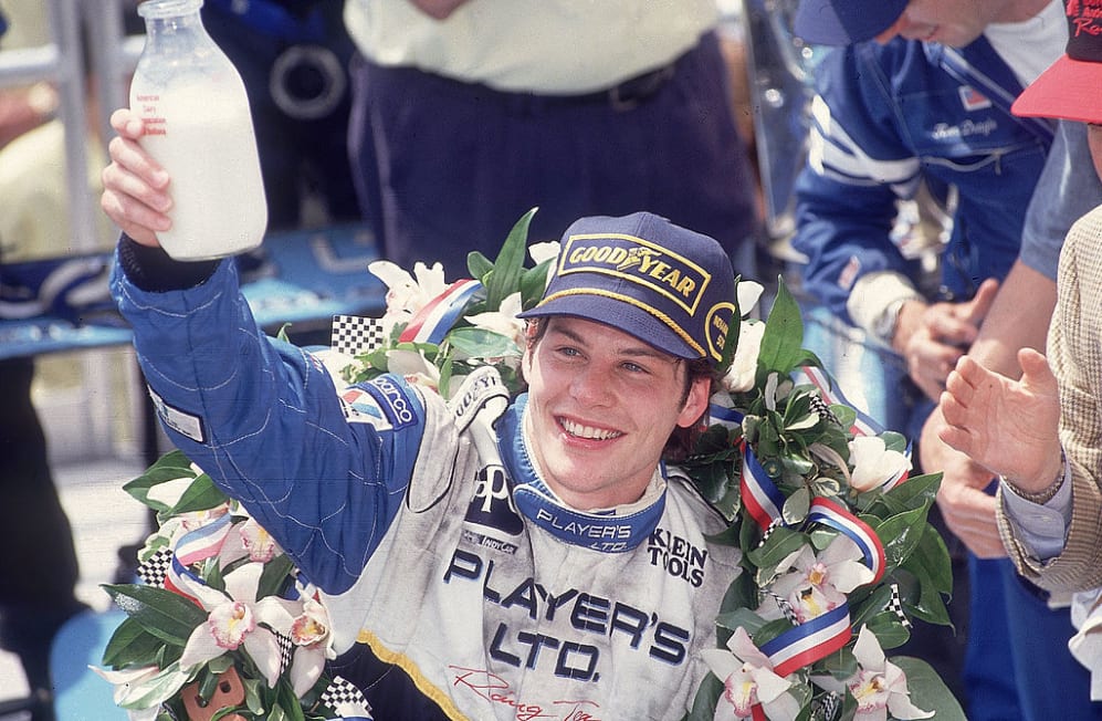 Auto Racing: Indianapolis 500: Jacques Villeneuve victorious with bottle of milk in hand during