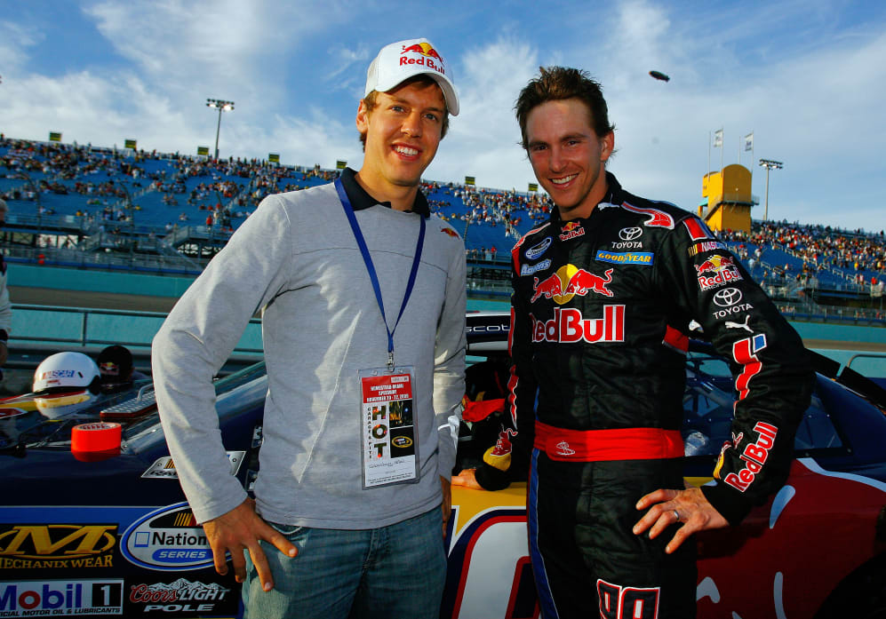 HOMESTEAD, FL - NOVEMBER 21:  German Formula 1 driver Sebastian Vettel (L) of Red Bull Racing and