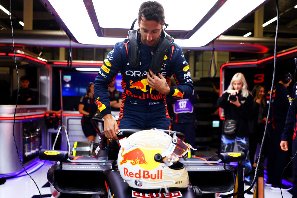 NORTHAMPTON, ENGLAND - JULY 11:  Daniel Ricciardo of Australia climbs into the (3) Oracle Red Bull