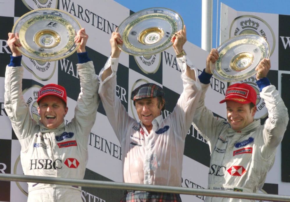 Brittish Stewart-Ford driver Johnny Herbert, his team manager Jackie Stewart and Brazilian teamate