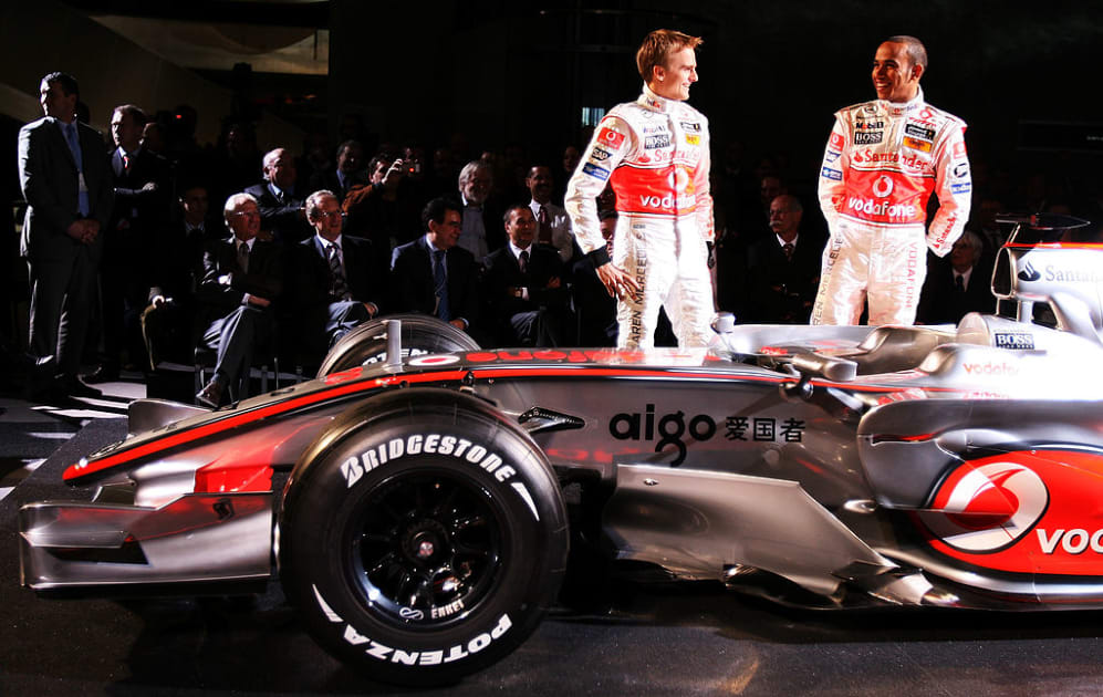 STUTTGART, GERMANY - JANUARY 07:  Heikki Kovalainen of Finland and Lewis Hamilton of Great Britain