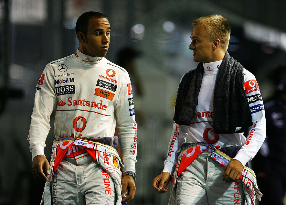 SINGAPORE - SEPTEMBER 27:  (L-R) Lewis Hamilton of Great Britain and McLaren Mercedes and Heikki