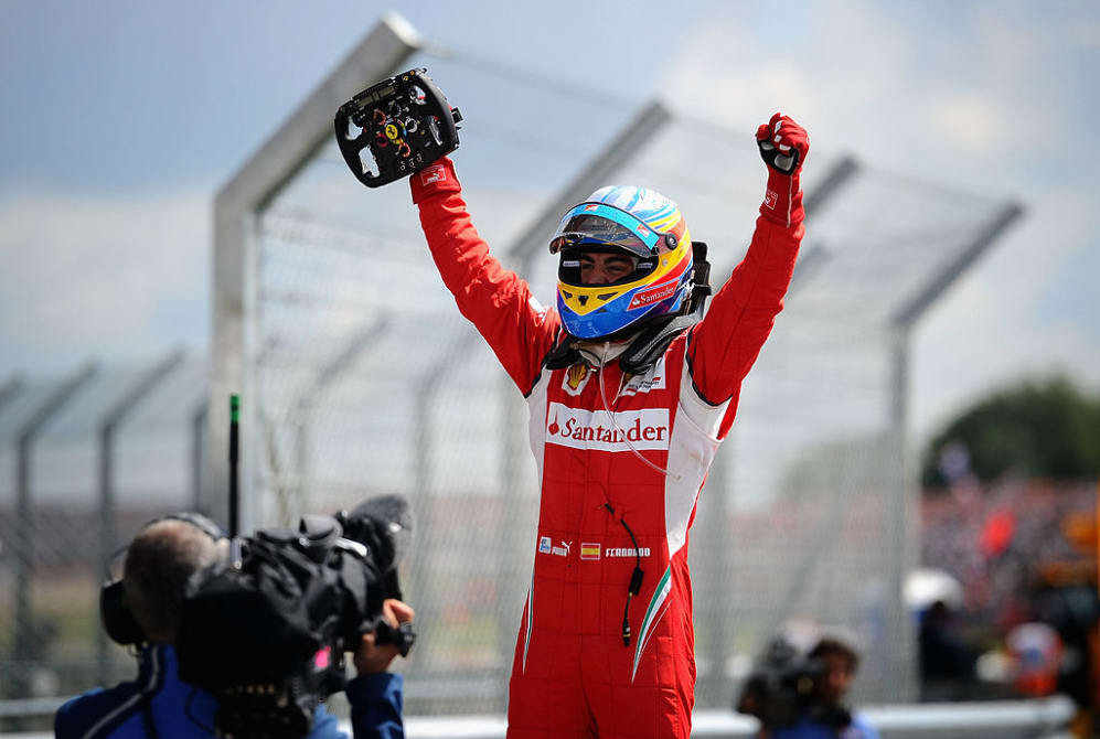 NORTHAMPTON, UNITED KINGDOM - JULY 10:  Fernando Alonso of Spain and Ferrari celebrates in parc