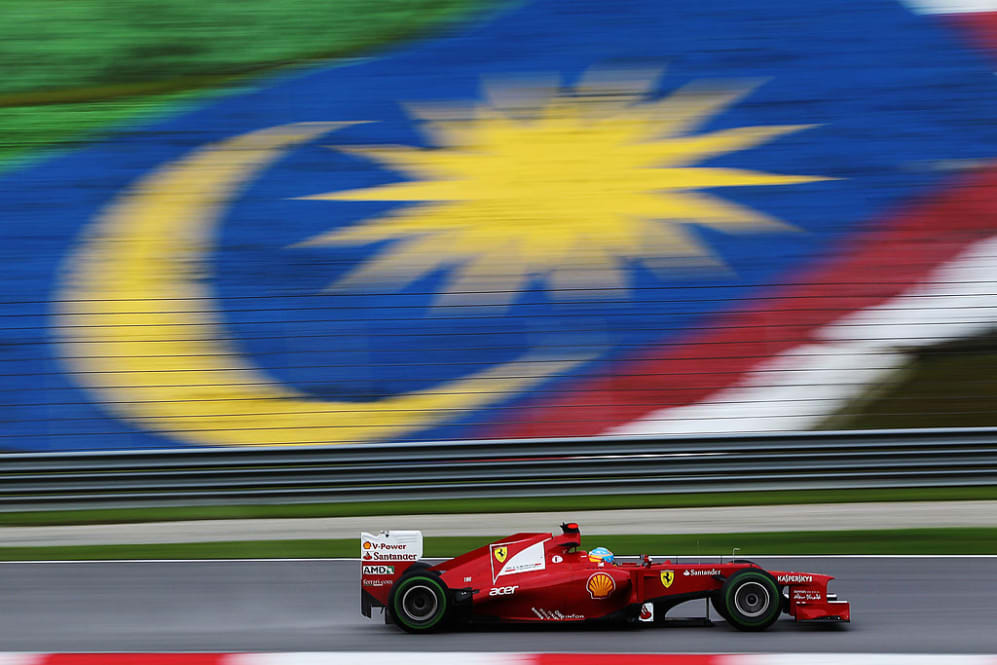 KUALA LUMPUR, MALAYSIA - MARCH 25:  Fernando Alonso of Spain and Ferrari drives on his way to