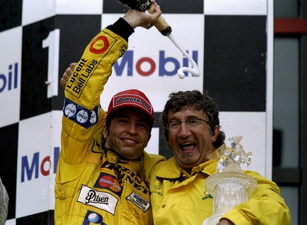 27 Jun 1999:  Heinz-Harald Frentzen of the Jordan team celebrates and is congratulated by owner