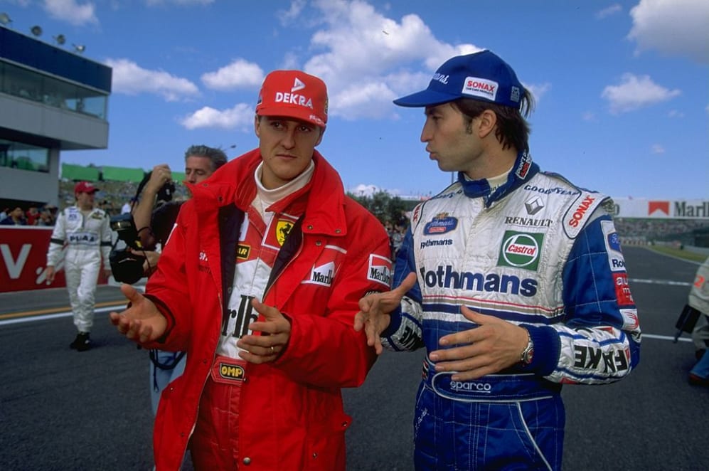 12 Oct 1997:  Ferrari driver, Michael Schumacher of Germany (left) talks to Williams-Renault