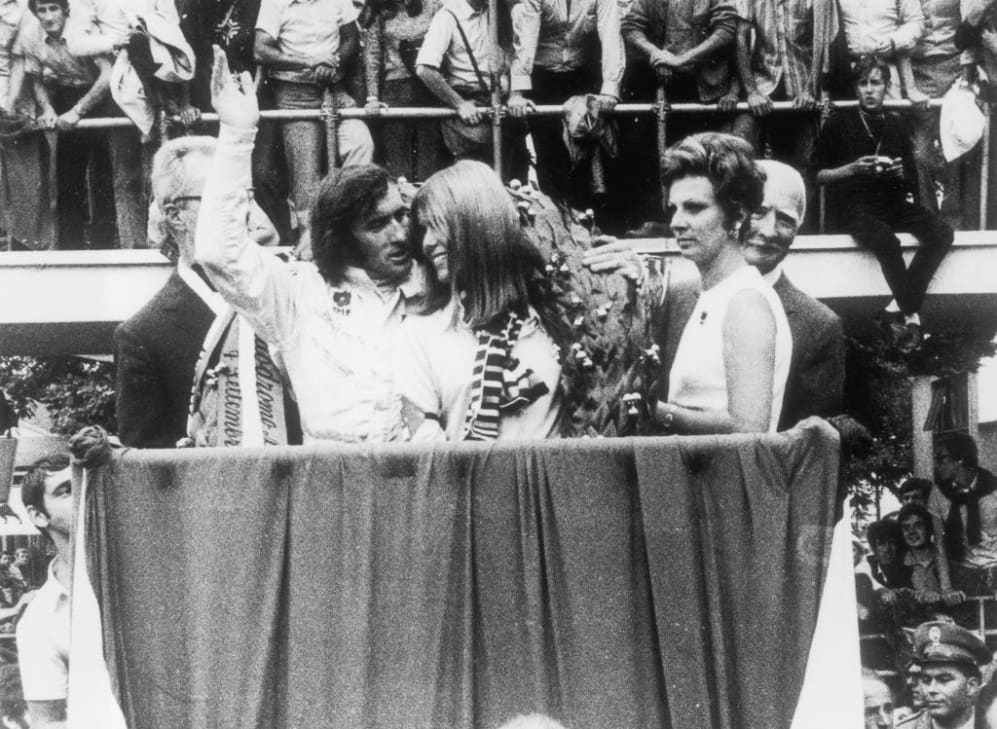 9th September 1969:  British racing driver Jackie Stewart on the winner's rostrum with his wife,