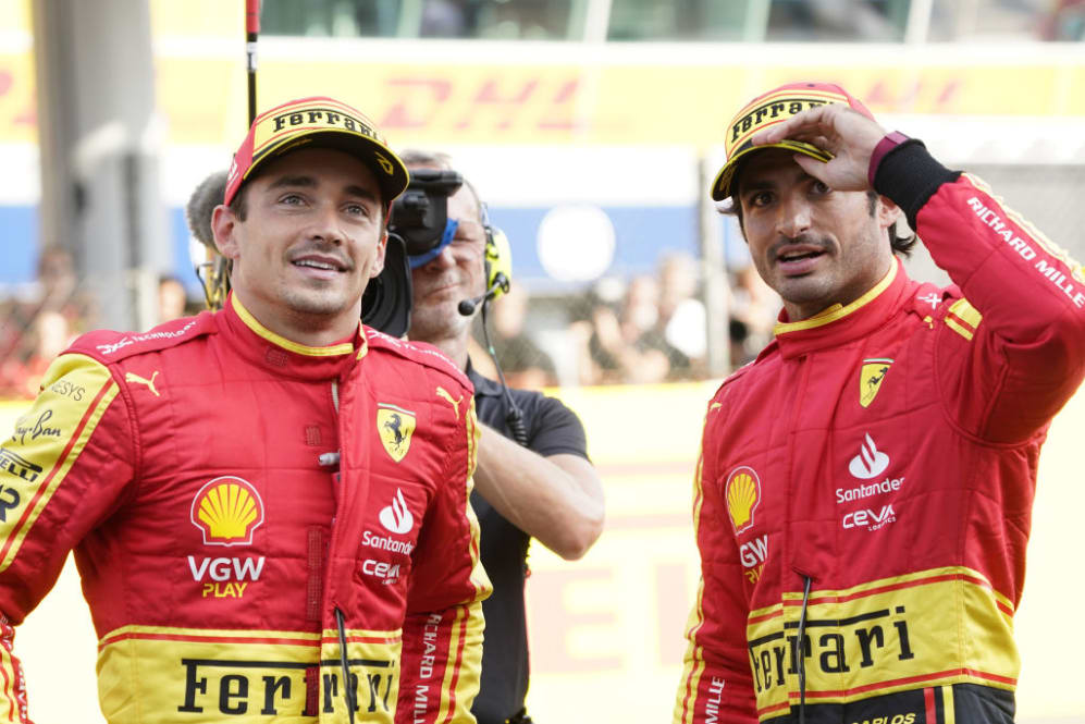 MONZA, ITALY - SEPTEMBER 02: Ferrari's drivers Carlos Sainz Jr and Charles Leclerc at the end of