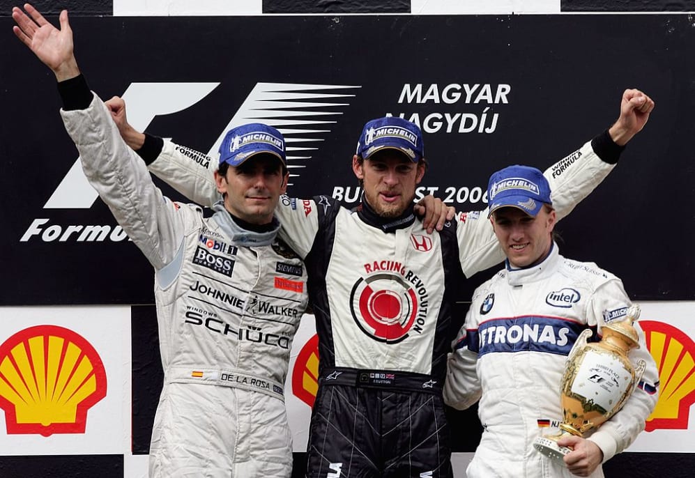 BUDAPEST, HUNGARY - AUGUST 6: Jenson Button of Great Britain and Honda Racing (C) celebrates with