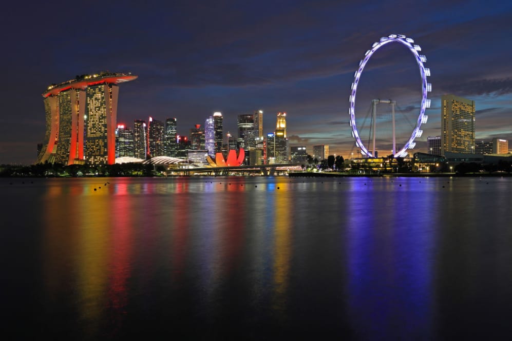 SINGAPORE, SINGAPORE - AUGUST 19: The Singapore Flyer is lit up to celebrate the launch of the