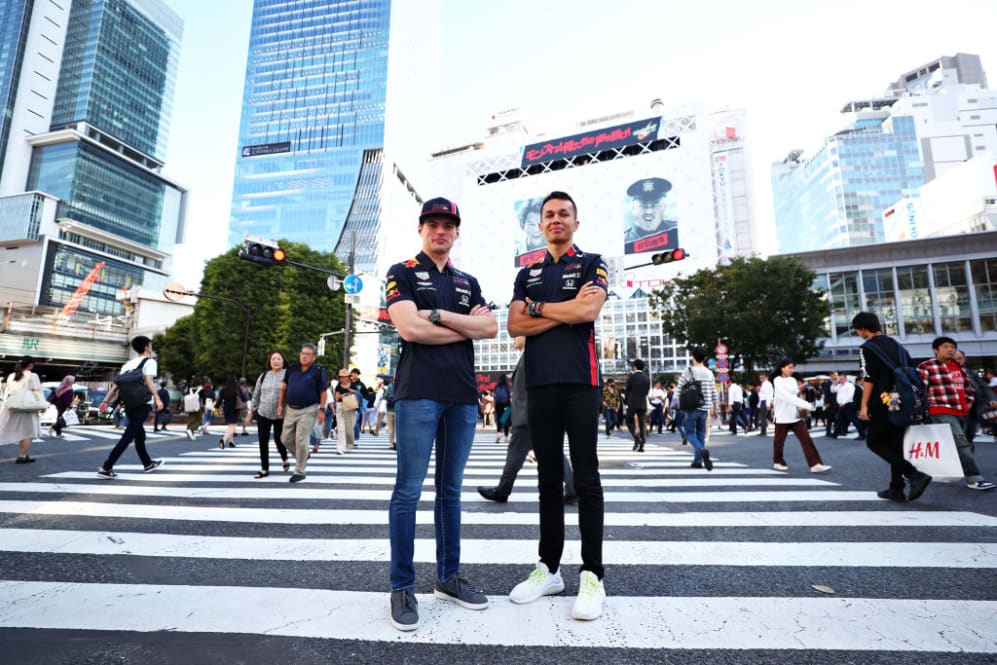 TOKYO, JAPAN - OCTOBER 09: Max Verstappen of Netherlands and Red Bull Racing and Alexander Albon of