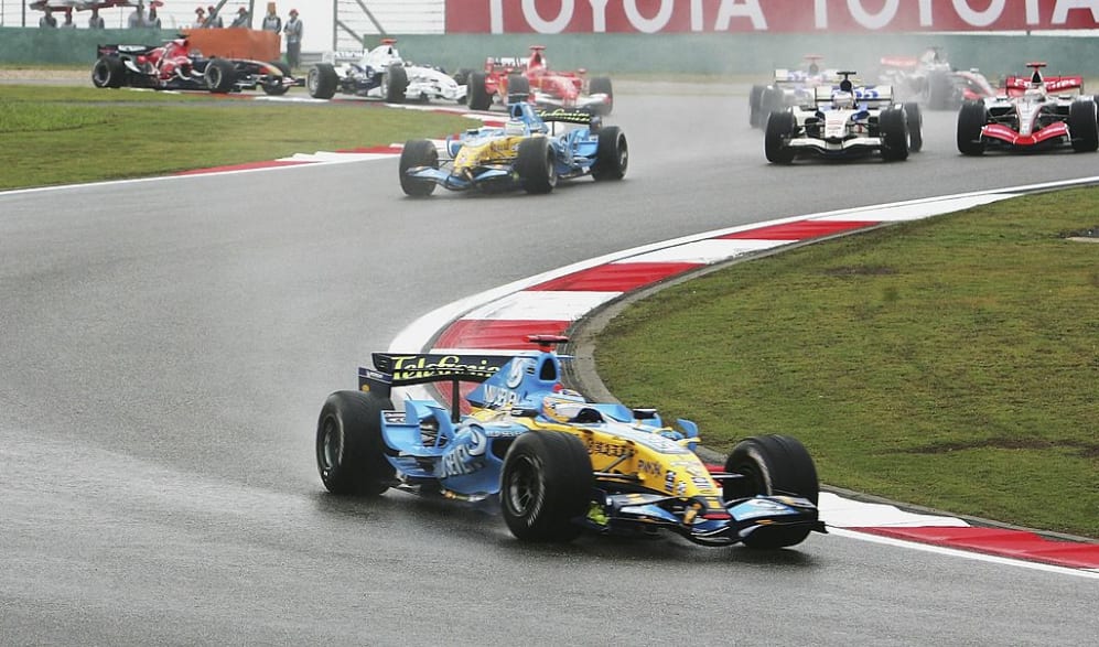 SHANGHAI, CHINA - OCTOBER 01:  Fernando Alonso of Spain and Renault leads the pack around the third