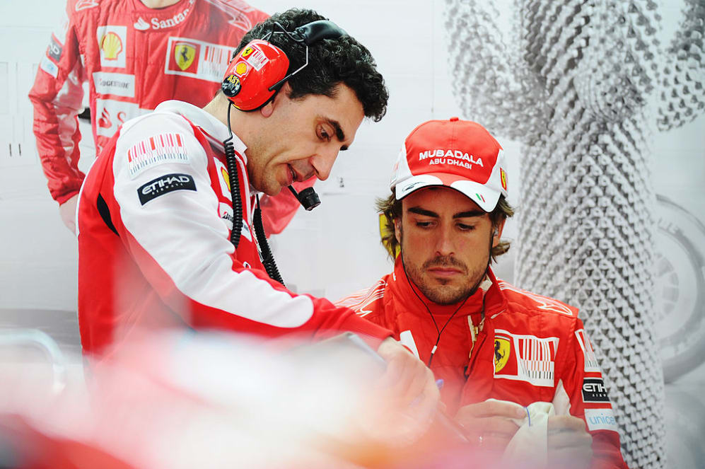 YEONGAM GUN, SOUTH KOREA - OCTOBER 22:  Fernando Alonso of Spain and Ferrari talks with his race