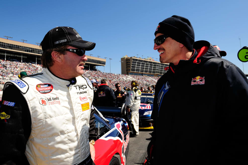 HAMPTON, GA - MARCH 09:  Mike Skinner, driver of the #84 Red Bull Toyota, speaks with Gunther