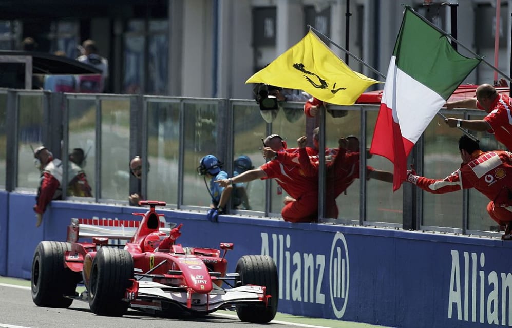 MAGNY-COURS, FRANCE - JULY 16:  Michael Schumacher of Germany and Ferrari celebrates winning the