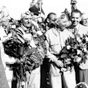  Giuseppe Farina and Luigi Fagioli celebrate on the first-ever World Championship podium