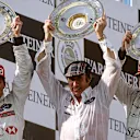 Johnny Herbert, Jackie Stewart and Rubens Barrichello celebrate on the podium at the European Grand Prix