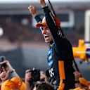 ABU DHABI, UNITED ARAB EMIRATES - DECEMBER 07: 2025 F1 World Drivers Champion Lando Norris of Great Britain and McLaren celebrates with his team during the F1 Grand Prix of Abu Dhabi at Yas Marina Circuit on December 07, 2025 in Abu Dhabi, United Arab Emirates. (Photo by Clive Rose/Getty Images)