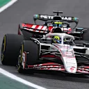SAO PAULO, BRAZIL - NOVEMBER 09: Oliver Bearman of Great Britain driving the (87) Haas F1 VF-25 Ferrari leads George Russell of Great Britain driving the (63) Mercedes AMG Petronas F1 Team W16 on track during the F1 Grand Prix of Brazil at Autodromo Jose Carlos Pace on November 09, 2025 in Sao Paulo, Brazil. (Photo by Mark Thompson/Getty Images)