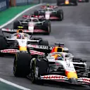 SAO PAULO, BRAZIL - NOVEMBER 08: Isack Hadjar of France driving the (6) Visa Cash App Racing Bulls VCARB 02 leads Liam Lawson of New Zealand driving the (30) Visa Cash App Racing Bulls VCARB 02 and Esteban Ocon of France driving the (31) Haas F1 VF-25 Ferrari on track during the Sprint ahead of the F1 Grand Prix of Brazil at Autodromo Jose Carlos Pace on November 08, 2025 in Sao Paulo, Brazil. (Photo by Mark Thompson/Getty Images)