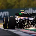 BUDAPEST, HUNGARY - AUGUST 01: Sparks fly behind Liam Lawson of New Zealand driving the (30) Visa Cash App Racing Bulls VCARB 02 on track during practice ahead of the F1 Grand Prix of Hungary at Hungaroring on August 01, 2025 in Budapest, Hungary. (Photo by Mark Thompson/Getty Images)