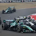 SHANGHAI, CHINA - MARCH 15: Fernando Alonso of Spain driving the (14) Aston Martin F1 Team AMR26 Honda leads as Valtteri Bottas of Finland driving the (77) Cadillac F1 Team MAC-26 Ferrari and Sergio Perez of Mexico driving the (11) Cadillac F1 Team MAC-26 Ferrari collide at the start during the F1 Grand Prix of China at Shanghai International Circuit on March 15, 2026 in Shanghai, China. (Photo by Mark Thompson/Getty Images)