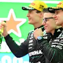 SHANGHAI, CHINA - MARCH 15: Race winner Andrea Kimi Antonelli of Italy and Mercedes AMG Petronas F1 Team Second placed George Russell of Great Britain and Mercedes AMG Petronas F1 Team and Peter Bonnington, Race Engineer of Mercedes AMG Petronas F1 Team on the podium during the F1 Grand Prix of China at Shanghai International Circuit on March 15, 2026 in Shanghai, China. (Photo by Mark Sutton - Formula 1/Formula 1 via Getty Images)