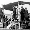 Members of the Royal Family watch on from the Royal Box at the side of the track