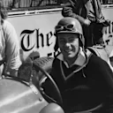  Johnny Claes smiles for the cameras in the pit lane between track runs