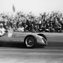 Baron Emmanuel de Graffenried drives his Maserati around Silverstone’s high-speed sweeps