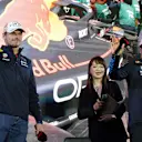Red Bull Racing's Dutch driver Max Verstappen (L) and Mexican teammate Sergio Perez (R) wave to