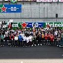 SHANGHAI, CHINA - MARCH 23: Drivers and team personnel gather in tribute to the late Eddie Jordan