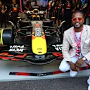 Former Manchester United footballer Patrice Evra outside the Red Bull garage