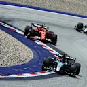 SPIELBERG, AUSTRIA - JUNE 29: George Russell of Great Britain driving the (63) Mercedes AMG Petronas F1 Team W15 leads Carlos Sainz of Spain driving (55) the Ferrari SF-24 on track during the Sprint ahead of the F1 Grand Prix of Austria at Red Bull Ring on June 29, 2024 in Spielberg, Austria. (Photo by Clive Rose/Getty Images)