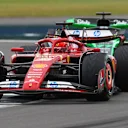 NORTHAMPTON, ENGLAND - JULY 07: Charles Leclerc of Monaco driving the (16) Ferrari SF-24 leads Valtteri Bottas of Finland driving the (77) Kick Sauber C44 Ferrari during the F1 Grand Prix of Great Britain at Silverstone Circuit on July 07, 2024 in Northampton, England. (Photo by Peter Fox - Formula 1/Formula 1 via Getty Images)