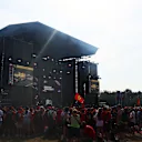 Crowds gather at the buzzing Fanzone stage to catch a glimpse of the drivers. Swipe for more photos