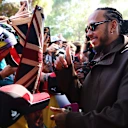 Lewis was all smiles with fans in Australia at the start of the season