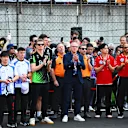 SHANGHAI, CHINA - MARCH 23: Drivers and team personnel gather for a tribute to the late Eddie