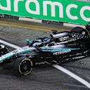 SINGAPORE, SINGAPORE - OCTOBER 03: George Russell of Great Britain driving the (63) Mercedes AMG Petronas F1 Team W16 crashes and damages his front wing during practice ahead of the F1 Grand Prix of Singapore at Marina Bay Street Circuit on October 03, 2025 in Singapore, Singapore. (Photo by Clive Rose - Formula 1/Formula 1 via Getty Images)