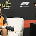 ABU DHABI, UNITED ARAB EMIRATES - DECEMBER 04: Oscar Piastri of Australia and McLaren speaks in the Drivers Press Conference next to the F1 World Drivers Championship trophy during previews ahead of the F1 Grand Prix of Abu Dhabi at Yas Marina Circuit on December 04, 2025 in Abu Dhabi, United Arab Emirates. (Photo by Mark Sutton - Formula 1/Formula 1 via Getty Images)