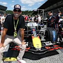 The former Liverpool manager was also seen soaking up the atmosphere on the grid in Austria