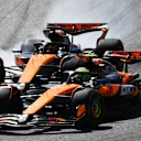SPIELBERG, AUSTRIA - JUNE 29: Lando Norris of Great Britain driving the (4) McLaren MCL39 Mercedes and Oscar Piastri of Australia driving the (81) McLaren MCL39 Mercedes battle for track position on track during the F1 Grand Prix of Austria at Red Bull Ring on June 29, 2025 in Spielberg, Austria. (Photo by James Sutton - Formula 1/Formula 1 via Getty Images)