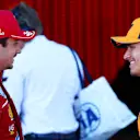 SPIELBERG, AUSTRIA - JUNE 28: Pole position qualifier Lando Norris of Great Britain and McLaren and Second placed qualifier Charles Leclerc of Monaco and Scuderia Ferrari talk in parc ferme during qualifying ahead of the F1 Grand Prix of Austria at Red Bull Ring on June 28, 2025 in Spielberg, Austria. (Photo by Joe Portlock/Getty Images)