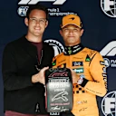 SPA, BELGIUM - JULY 26: Thierry Neuville presents Lando Norris of Great Britain and McLaren with his Pirelli Pole Position award during qualifying ahead of the F1 Grand Prix of Belgium at Circuit de Spa-Francorchamps on July 26, 2025 in Spa, Belgium. (Photo by Mark Sutton - Formula 1/Formula 1 via Getty Images)