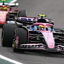 SAO PAULO, BRAZIL - NOVEMBER 09: Franco Colapinto of Argentina driving the (43) Alpine F1 A525 Renault leads Lewis Hamilton of Great Britain driving the (44) Scuderia Ferrari SF-25 on track during the F1 Grand Prix of Brazil at Autodromo Jose Carlos Pace on November 09, 2025 in Sao Paulo, Brazil. (Photo by Mark Thompson/Getty Images)