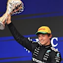 SAO PAULO, BRAZIL - NOVEMBER 09: Second placed Andrea Kimi Antonelli of Italy and Mercedes AMG Petronas F1 Team lifts his trophy on the podium during the F1 Grand Prix of Brazil at Autodromo Jose Carlos Pace on November 09, 2025 in Sao Paulo, Brazil. (Photo by Buda Mendes/Getty Images)