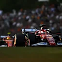 BUDAPEST, HUNGARY - AUGUST 01: Charles Leclerc of Monaco driving the (16) Scuderia Ferrari SF-25 leads Lewis Hamilton of Great Britain driving the (44) Scuderia Ferrari SF-25 on track during practice ahead of the F1 Grand Prix of Hungary at Hungaroring on August 01, 2025 in Budapest, Hungary. (Photo by Rudy Carezzevoli/Getty Images)