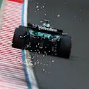 BUDAPEST, HUNGARY - AUGUST 02: Sparks fly behind Lance Stroll of Canada driving the (18) Aston Martin F1 Team AMR25 Mercedes on track during qualifying ahead of the F1 Grand Prix of Hungary at Hungaroring on August 02, 2025 in Budapest, Hungary. (Photo by Clive Rose/Getty Images)