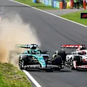 MONZA, ITALY - SEPTEMBER 07: Lance Stroll of Canada driving the (18) Aston Martin F1 Team AMR25 Mercedes and Esteban Ocon of France driving the (31) Haas F1 VF-25 Ferrari battle for track position during the F1 Grand Prix of Italy at Autodromo Nazionale Monza on September 07, 2025 in Monza, Italy. (Photo by James Sutton - Formula 1/Formula 1 via Getty Images)