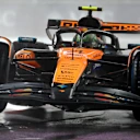 LAS VEGAS, NEVADA - NOVEMBER 21: Lando Norris of Great Britain driving the (4) McLaren MCL39 Mercedes lifts a wheel on track during qualifying ahead of the F1 Grand Prix of Las Vegas at Las Vegas Strip Circuit on November 21, 2025 in Las Vegas, Nevada. (Photo by Clive Rose/Getty Images)